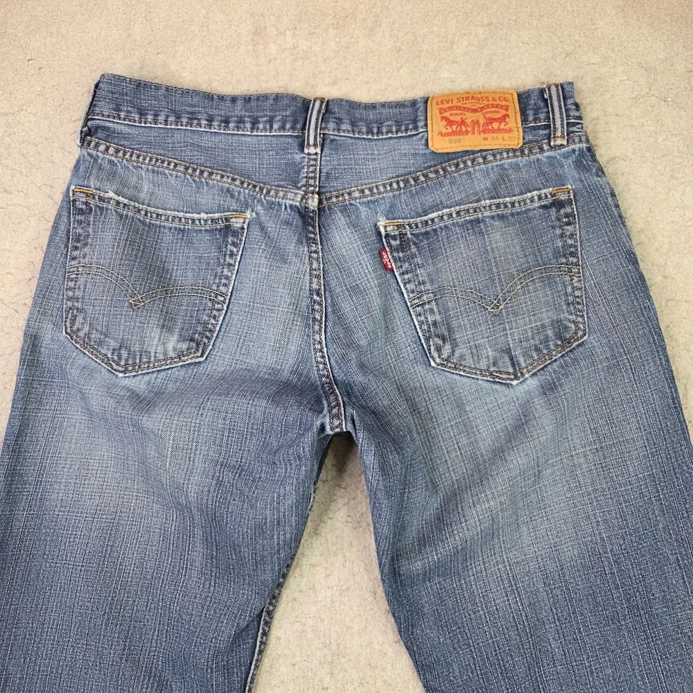 Levi's 559 Jeans Men's Size 34x32 Blue Fade Denim Straight Leg Fit‎ Distressed